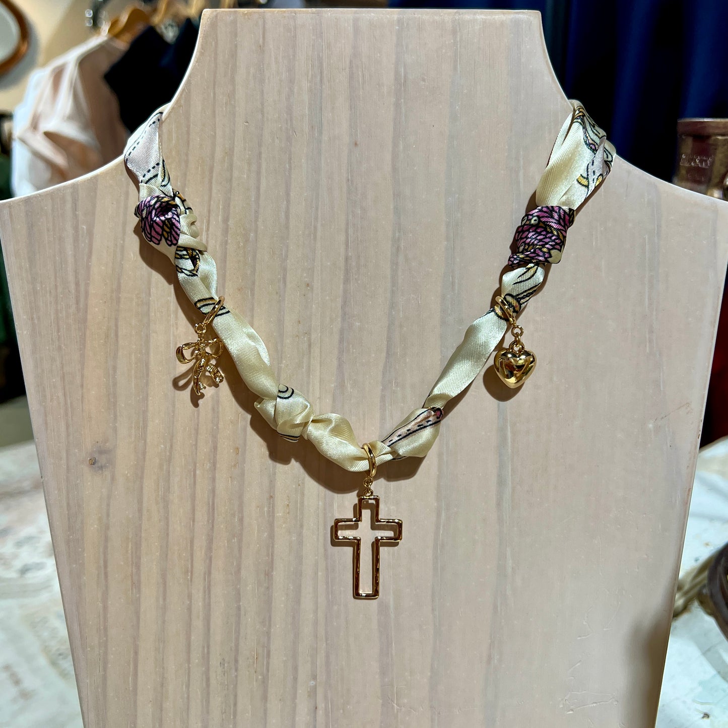 Cream Knotted Scarf Necklace with Heart, Cross, and Bow Charms